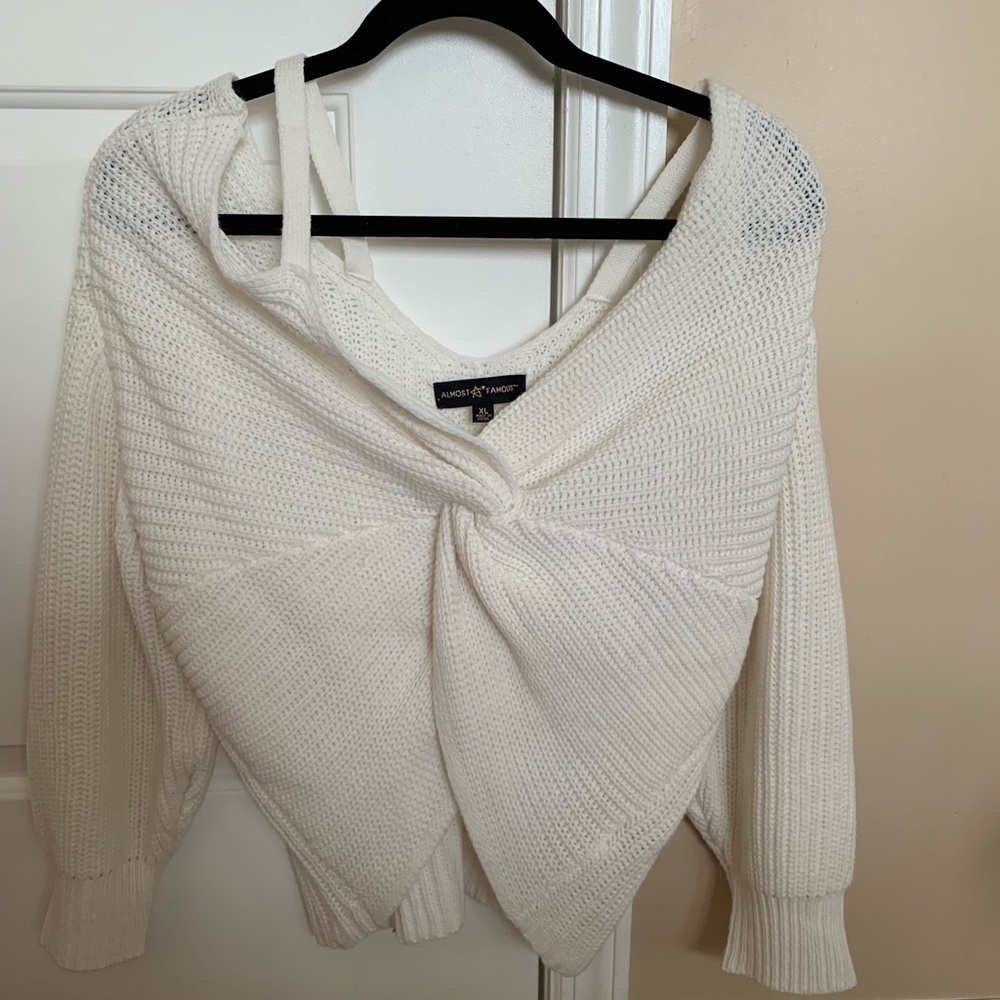 Cold shoulder front twist sweater